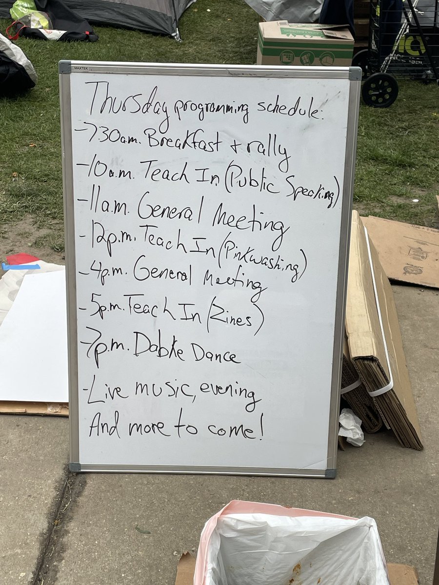 Groggy morning at the UW-Madison encampment. Day 4. Students who stayed overnight wash their faces with water bottles and wait in line for coffee to arrive. Organizers say Chancellor Mnookin is meeting with students this morning at Bascom Hall. Reporting for @WORTnews