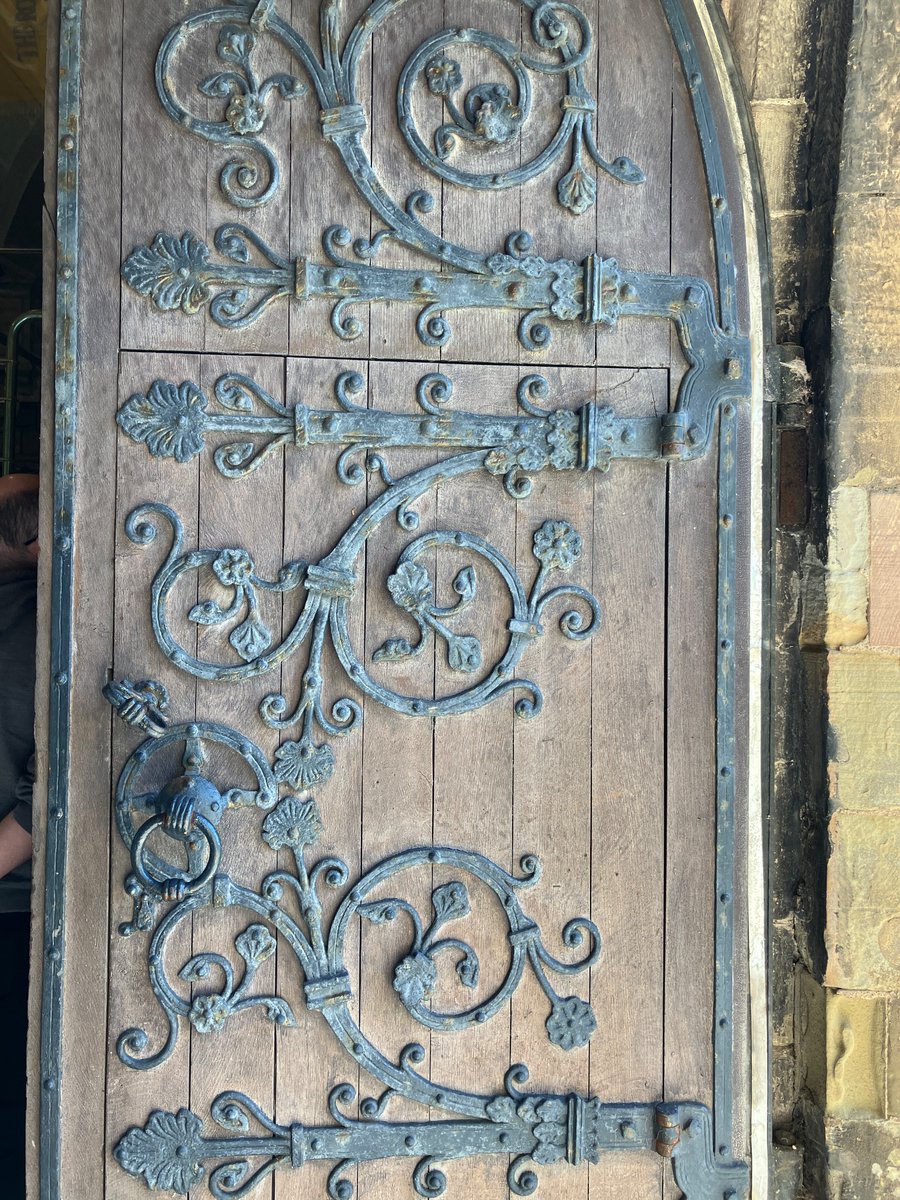 The west door of St Asaph’s cathedral with its beautiful iron scroll work. No idea how old it is - I just liked it #ironworkThursday #adoorableThursday