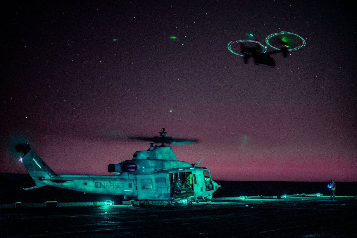 No matter when the call arrives, our Nation can always count on its Marines for a swift response. A UH-1Y Venom prepares for takeoff in the Pacific Ocean as an MV-22B Osprey flies above.