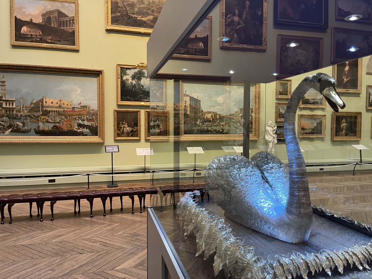 The Silver Swan is back in the @TheBowesMuseum picture galleries so more people can experience her daily 2 p.m. playing. Thanks to all who supported her restoration to working order. It feels appropriate she's sitting in front of paintings of canals in Venice! 1/2 #SilverSwan