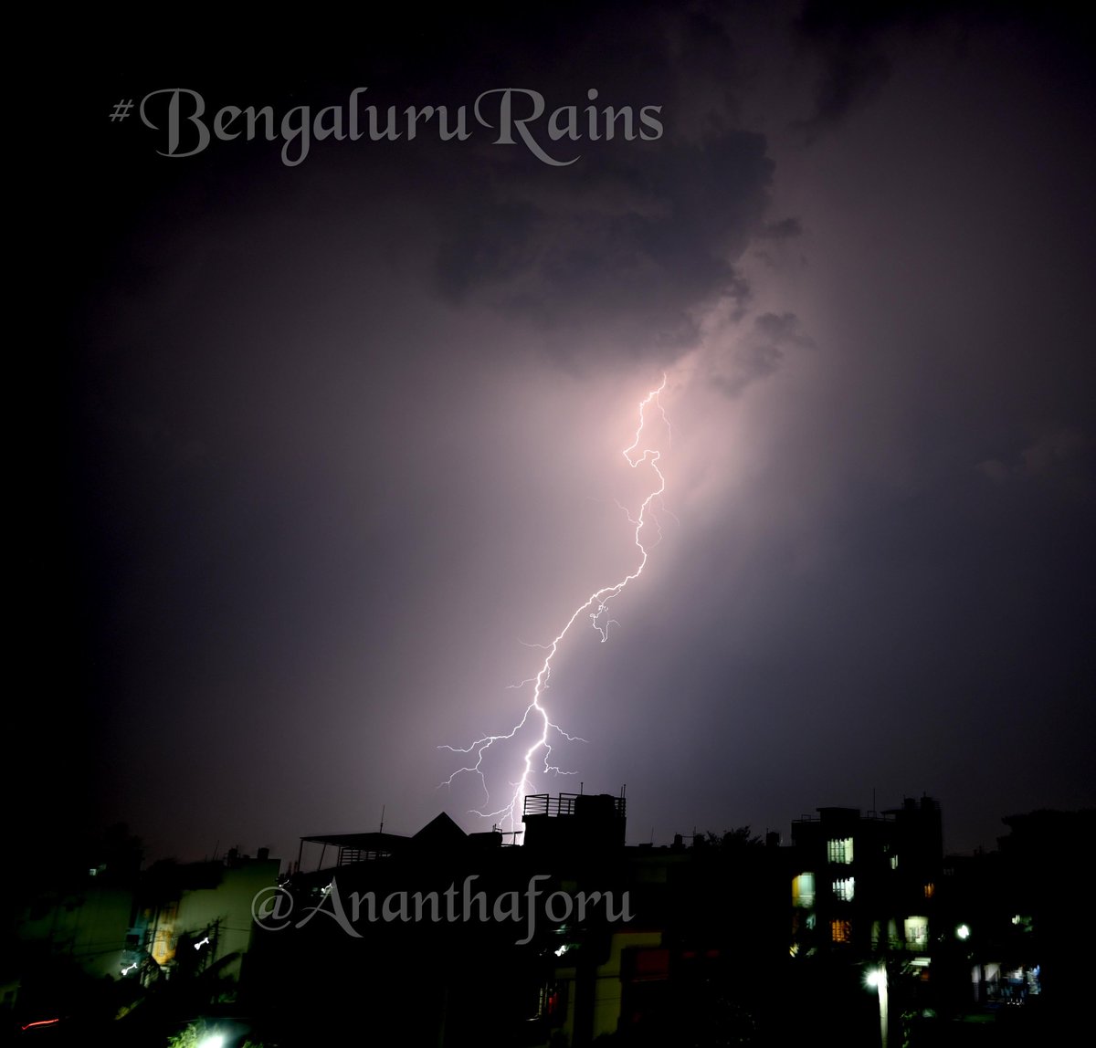 A young boy just braked and stopped amidst sudden downpour, as if wanted to give me this excellent capture, assisted by those car headlights. And the #Lightning was just a #BoltFromTheBlue Covered for @hhdigital #BengaluruRains #BangaloreRain