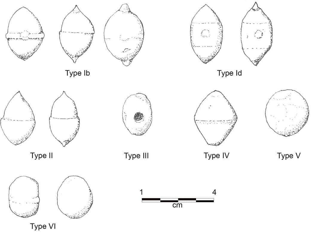 Some of the many sling #bullets found at #Burnswark. The small ones with a hole -second photo- are whistling sling bullets. Research suggests that they were a #Roman 'terror weapon'. The hole being designed to give the soaring bullets a sharp buzzing or whistling noise in flight