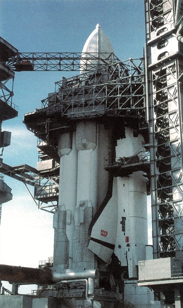 Buran and Energia 1L stacked on Baikonur's pad 110/37 ahead of the orbiter's maiden orbital flight. Note the massive rotating service tower (hugging the orbiter and the Energia rocket from the right side of the frame) carried over from the N-1 program (and modified for Energia).