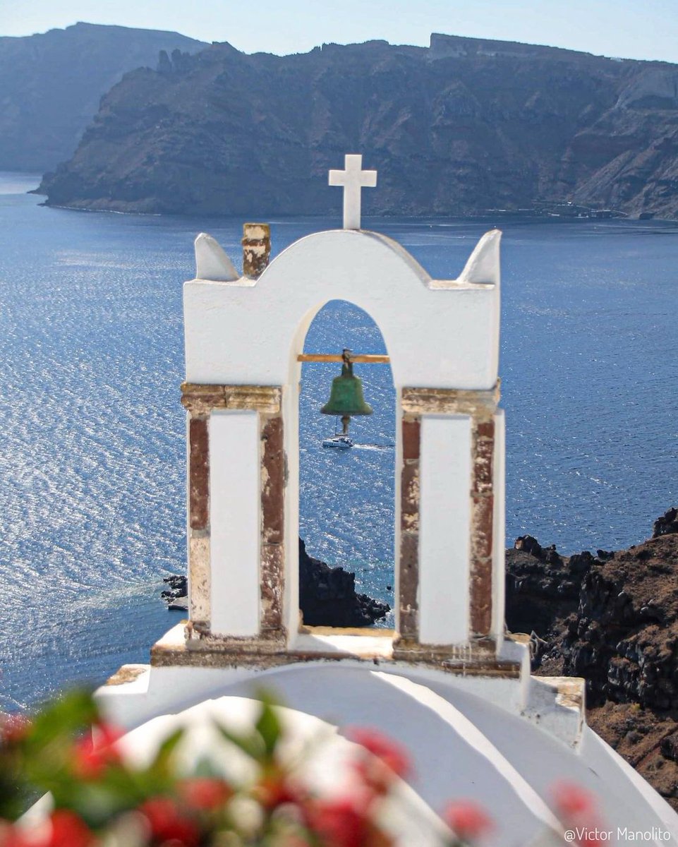 Where prayers mingle with the breeze, and faith is as deep as the sea beneath. 🇬🇷 📷 victor_manolito