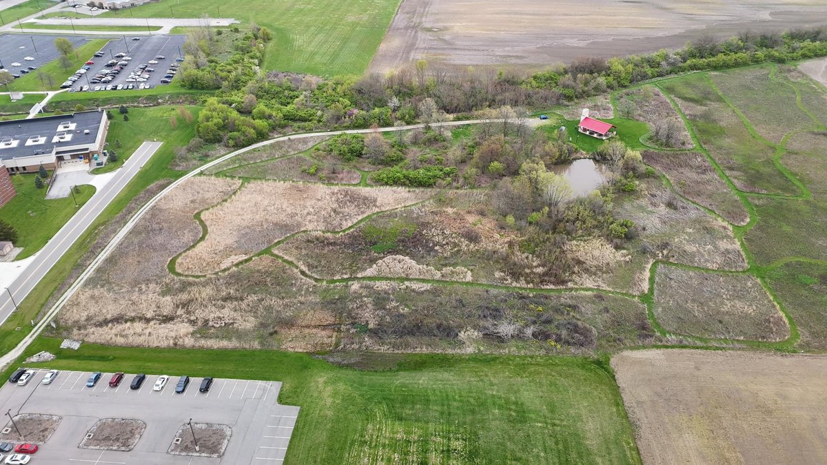 🌿✨ Explore the stunning aerial view of Larry R. Yoder Prairie Learning Laboratory at The Ohio State University, captured by Robert A. Klips! From 400 feet up, witness the beauty of native plants emerging amidst the landscape.
