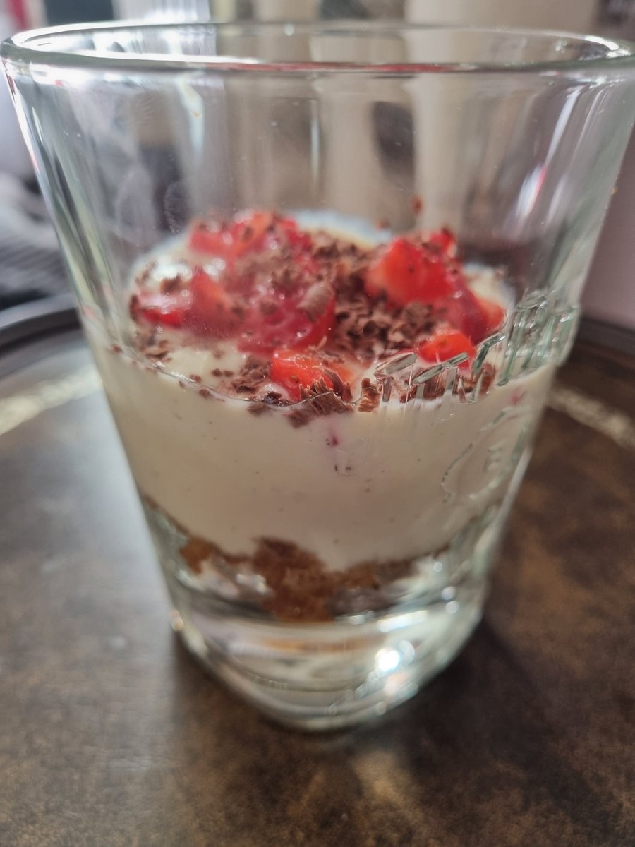 A little cheat dessert for all you healthy eaters out there.. I miss cheesecake, so I made my own version: 1 crushed up low sugar biscuit 2 dessert spoons plain fromage frais 1 strawberry chopped up into small pieces Tiny bit of grated dark chocolate Less than 100cal result