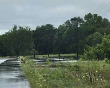 HOUSTON COUNTY FLOODING: These photos are FM 229 at Hurricane Bayou. Motorists should not attempt to drive through this area. Obey all traffic control set. Visit drivetexas.org for statewide closures. #TurnAroundDontDrown