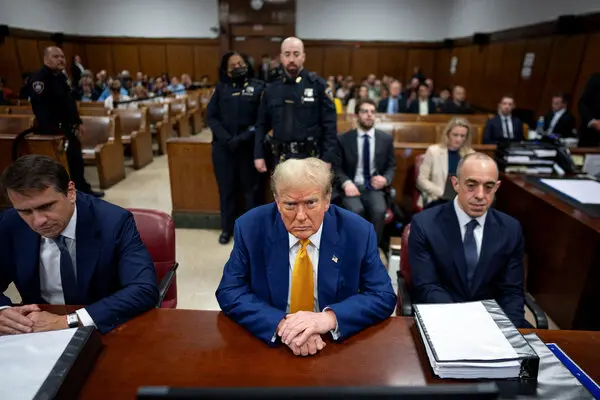 He looks so small, weak, cowardly, seething, with two very unhappy attorneys by his side.