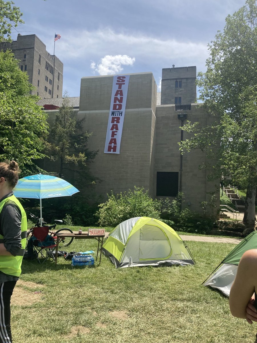 Huge banner dropped from Indiana Memorial Union, facing the encampment. Free Palestine.