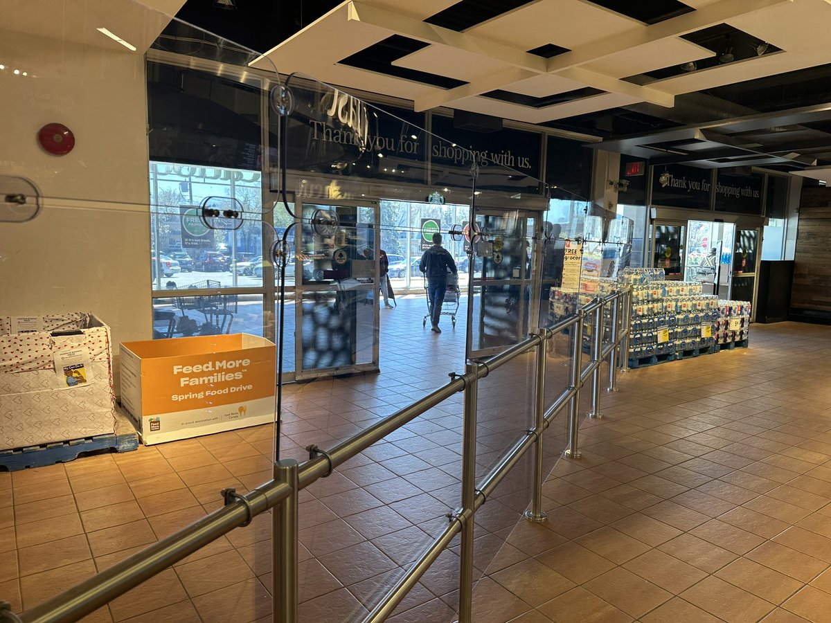 Plexiglass barriers block the exit at @loblawco in #toronto. The only path to the entrance doors is narrowed to less than 5 feet by a pillar. What do people in wheelchairs or those with cognitive impairment do in an emergency when faced with these barriers. @ChiefPeggTFS