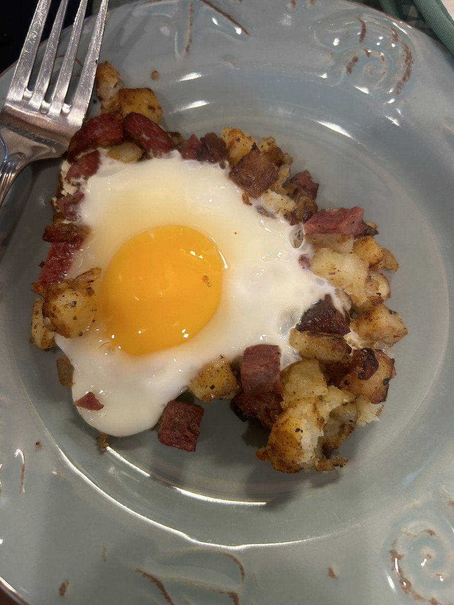 Corned beef hash, I like an egg on mine. I turned it over to get the white more solid. The second picture was for show