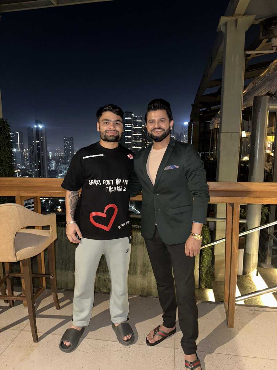 Suresh Raina shares a picture of his meeting with Rinku Singh. BUT our eyes are on the the shirt that has a cryptic message- 'Snakes don't hiss anymore, they kiss'. 👀🐍