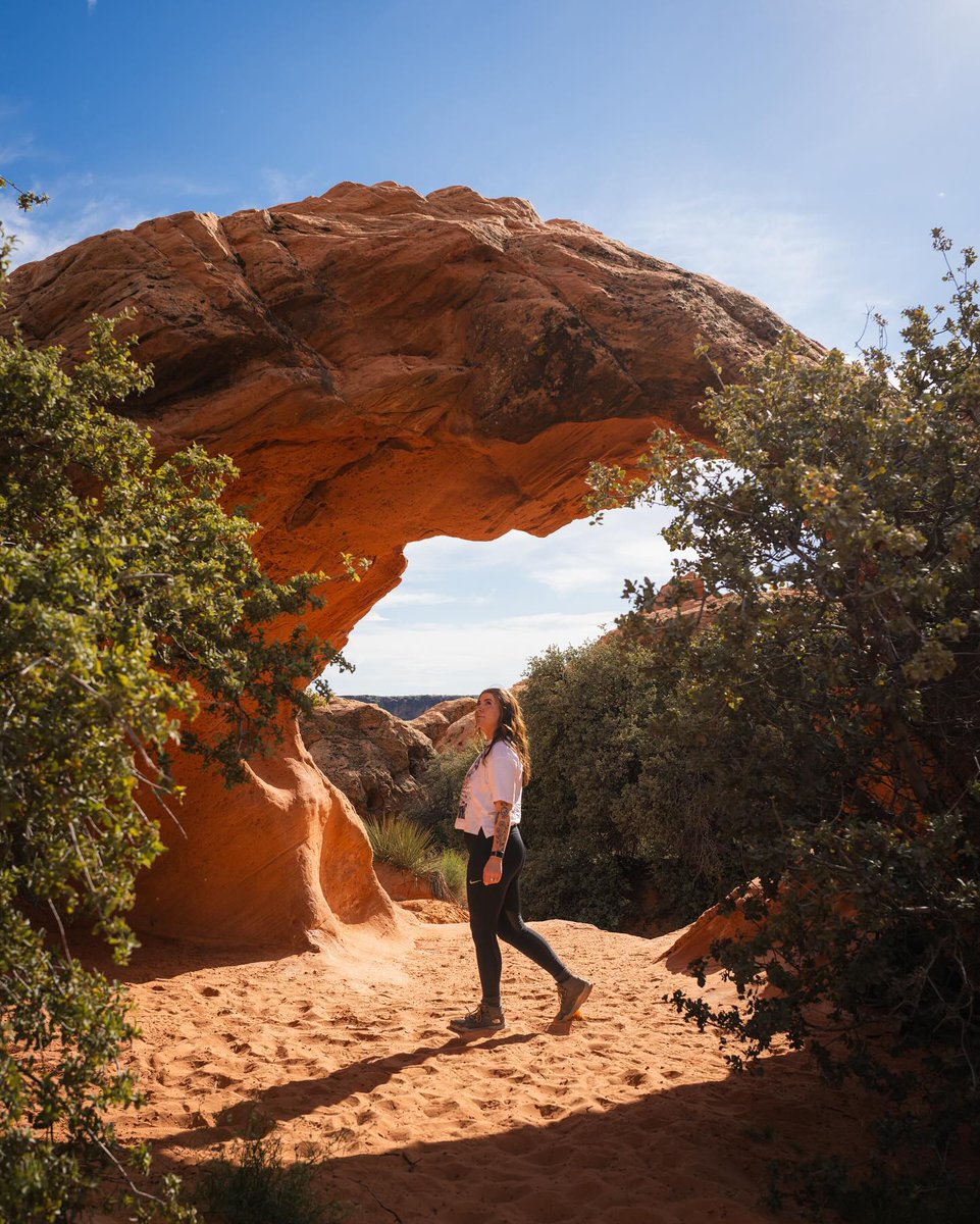 Stop the scroll and head outside this #MentalHealthAwarenessMonth 💚 Studies show that 20 to 30 minutes of natural light exposure can help improve your mood.  #GetOutThere for some some fun in the sun ☀️ bit.ly/4dd80Yk 

📸 @sweetadventuring
📍Babylon Arch Trail, Utah