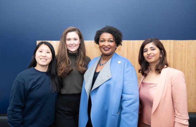 Photo of Leader Stacey Abrams and three individuals at the Consult Your Community 10th anniversary celebration.