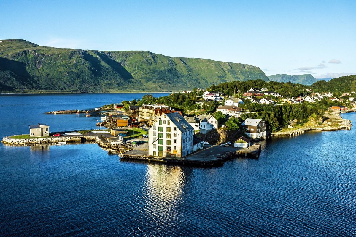 Alesund is Norway's charming art nouveau city by the sea!  Nestled between fjords and mountains, this picturesque town offers stunning views and unforgettable experiences. #VisitAlesund #NorwayTravel #Ålesund