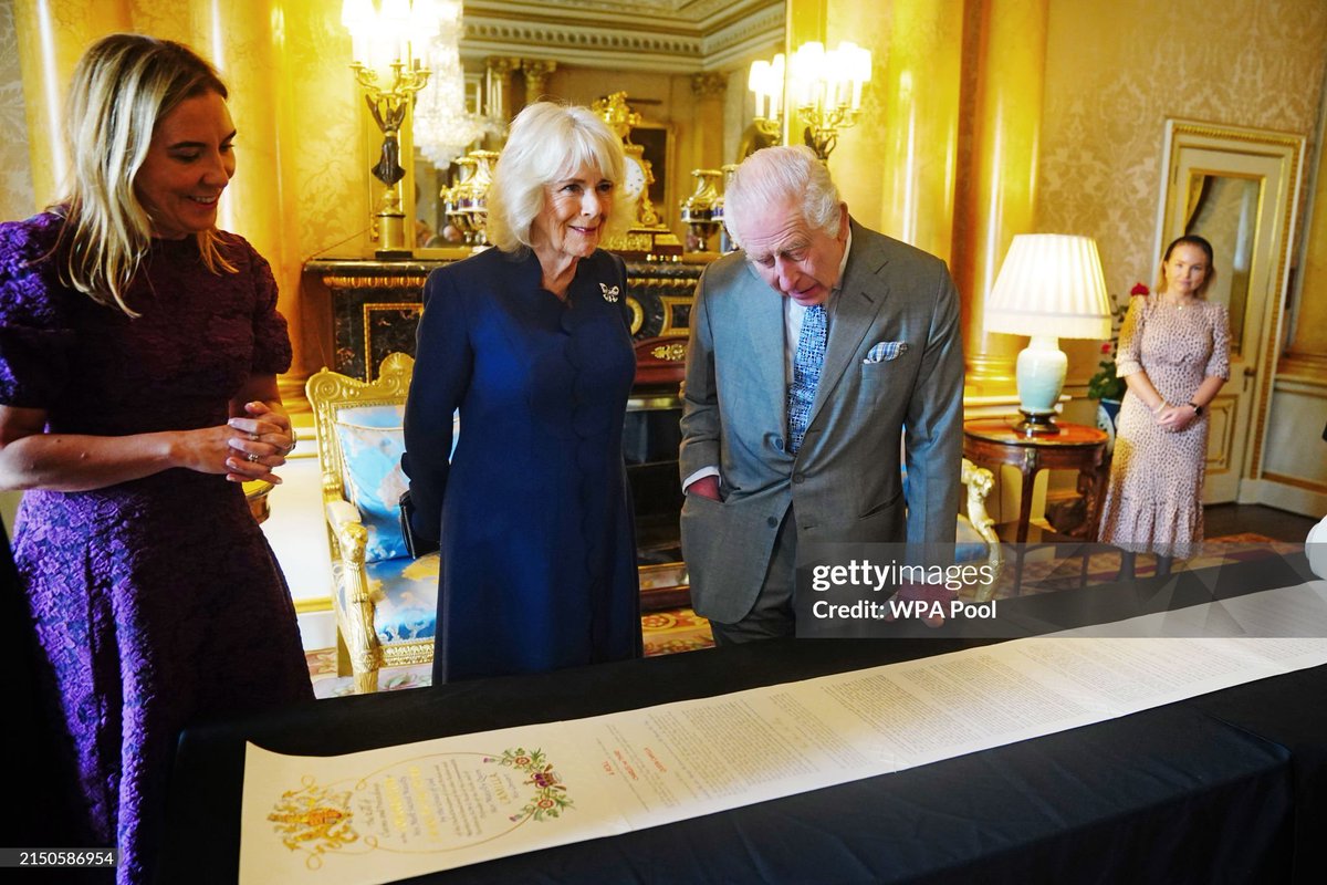 📜  King Charles and Queen Camilla are shown Coronation Rolls of previous monarchs after being presented with their own Coronation Roll.