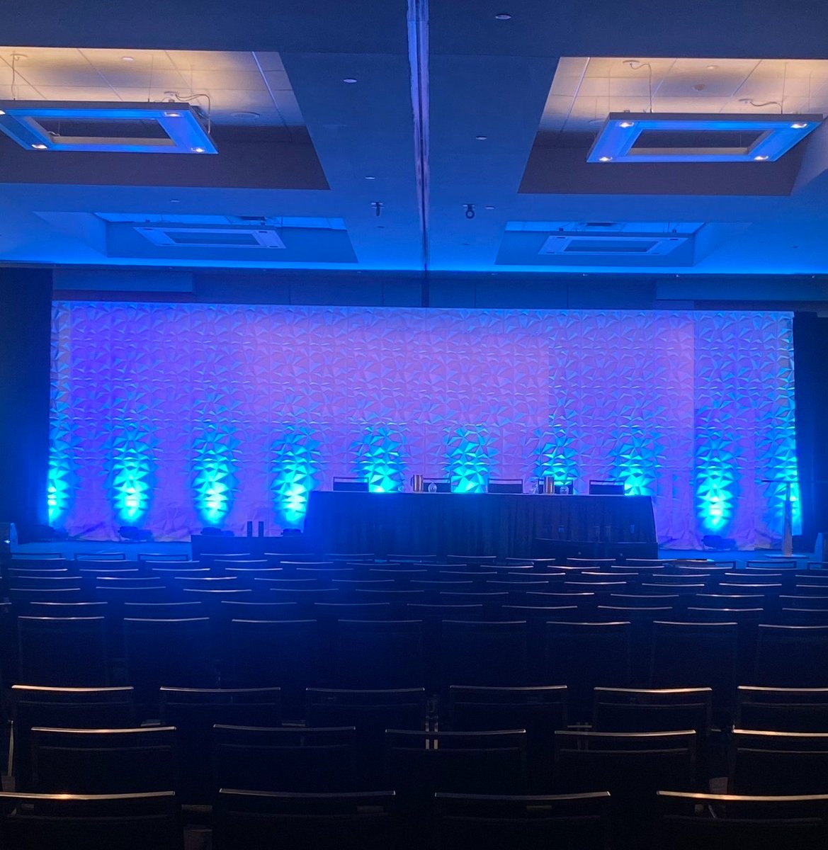 Another great show creating custom #stagedesigns for our clients, with special effects #lighting and textured backdrops! #eventprofs #meetings #eventplanner #events #liveevents #uplighting #AVprovider #AVproduction #AV #avtech #ledwall #accessibility #inclusivity #sustainability