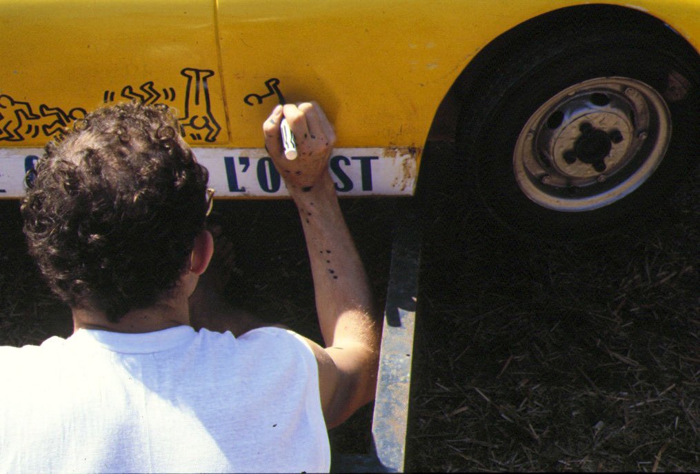 Keith Haring drawing on a 1962 SCAF/Mortarini Mini Ferrari 330 P-2 during the 24 Hours of Le Mans, 1984.