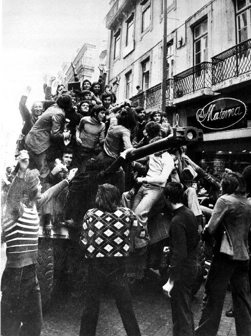 A crowd celebrates on a Panhard EBR armored car in Lisbon, Portugal during the Carnation Revolution (Revolução dos Cravos) 25 April 1974