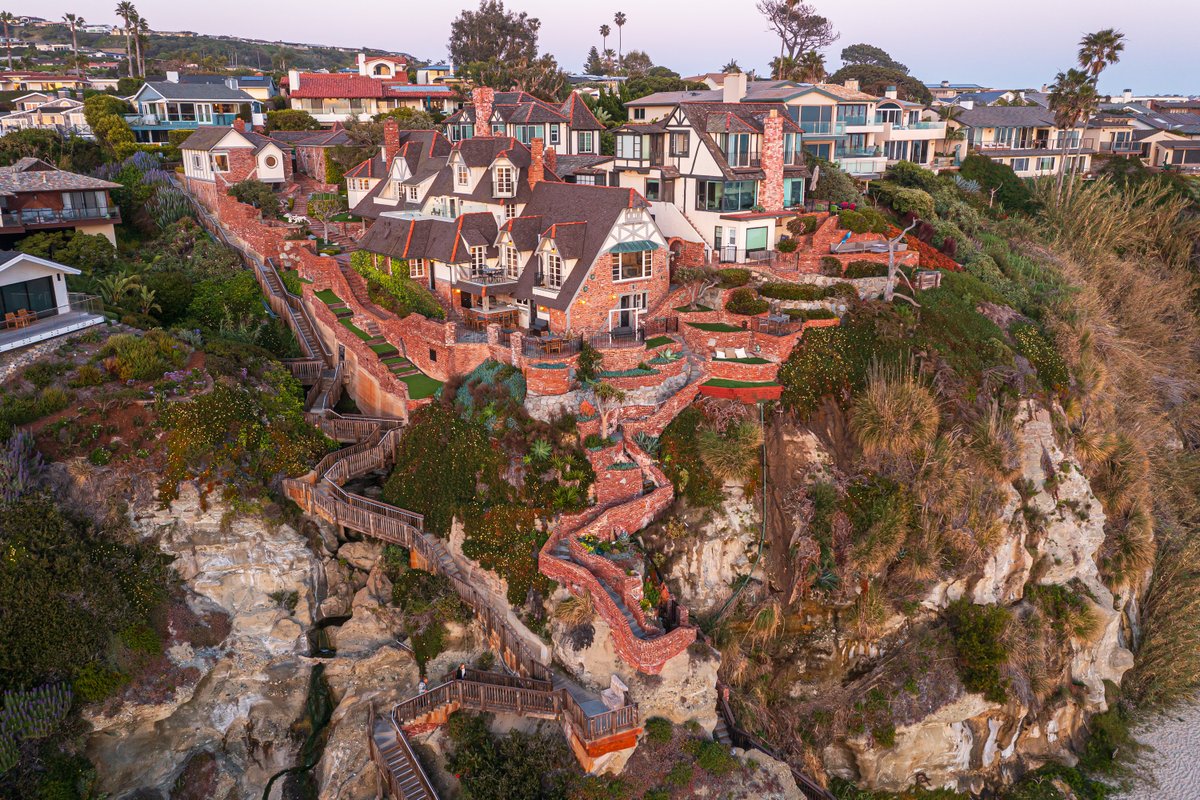 A Blufftop Beauty 🌊 Thoughtfully crafted in the 1930’s, this exceptionally rare and classic French Normandy sits perched on a front corner blufftop in Three Arch Bay of Laguna Beach. [Listing: @TheAltmanBros | tinyurl.com/6-Barranca-Way] #EllimanCalifornia #LagunaBeach