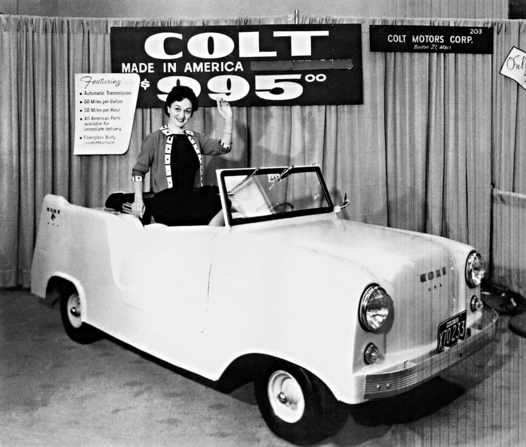 One of many unsuccessful attempts at producing a low-cost car for local transportation. This one is by Colt Motors Corp. of Boston, Massachusetts, offered with a 1 cylinder air-cooled engine for $995. Photo taken at an auto show, perhaps New York, 1958.

#drthehistories