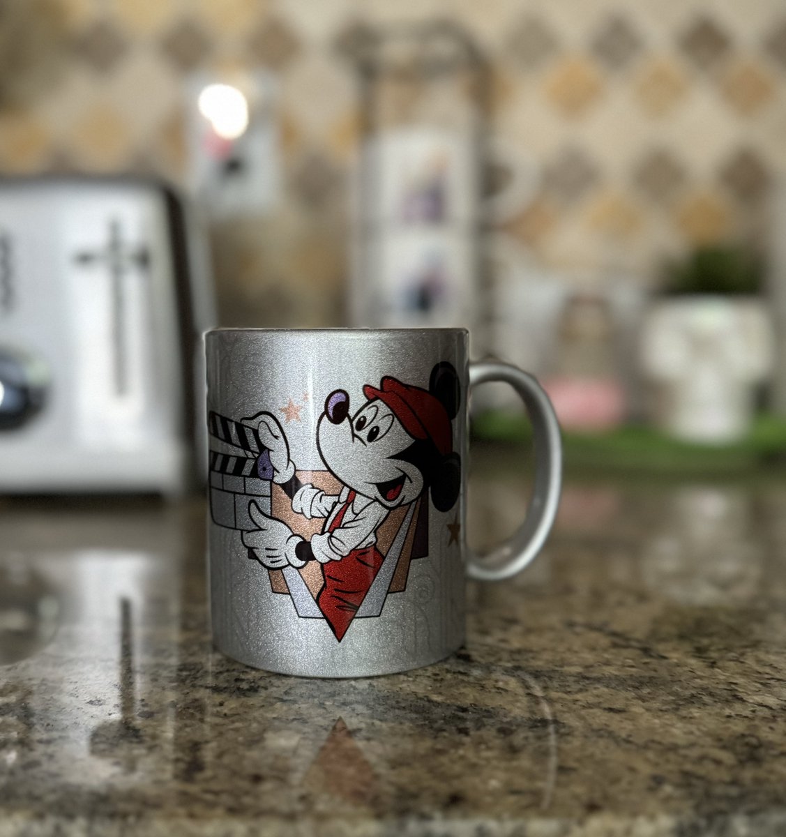 @kermitplaysbass I love that we still have a mug that kind of has a deconstructed version of that logo but with old timey filmmaker Mickey.