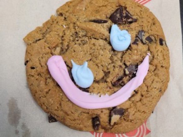 This is a perfect synonym for BLACKFACE Turdeaus Canada. A smile cookie from Tim Hortons that looks handicapped and like a handicapped person made it.