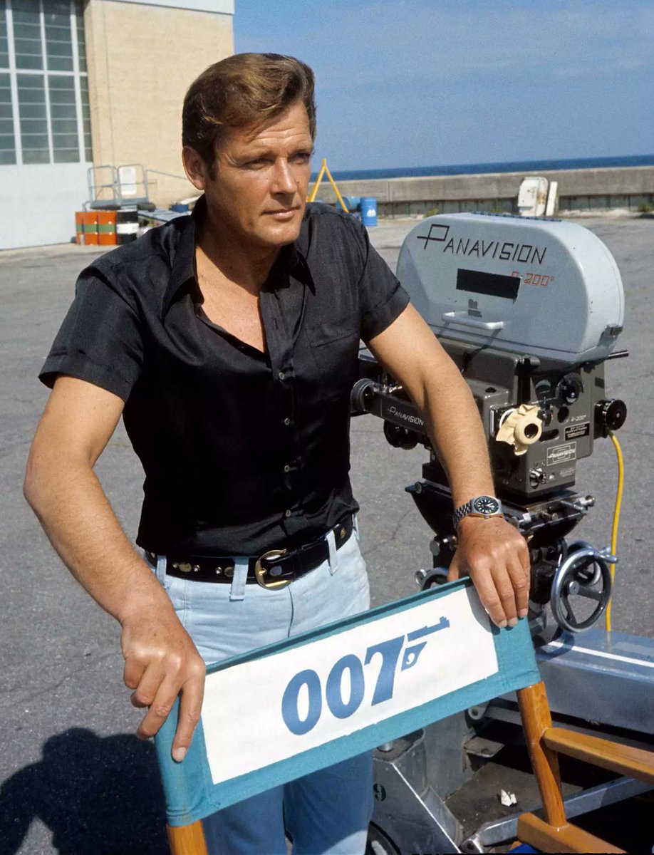 Roger Moore poses on the set of the eighth film in the James Bond series, Live and Let Die, in Kingston, Jamaica, 1973. Photo by Anwar Hussein.