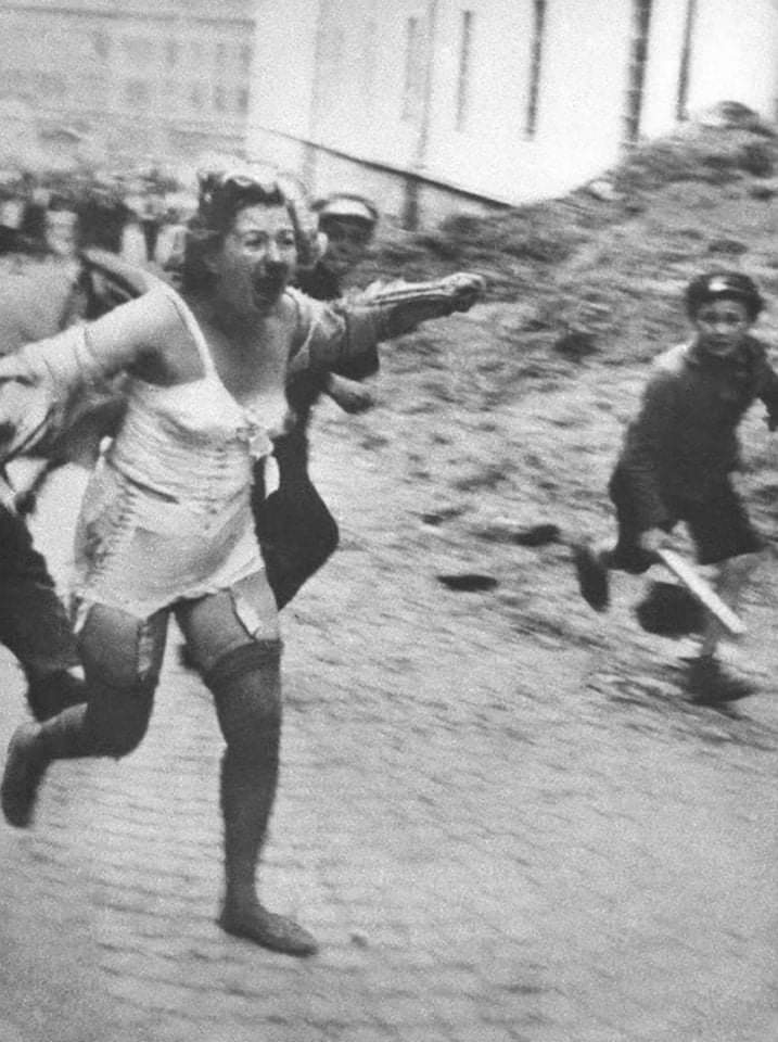 This Jewish woman was chased and beaten by a crowd of CHILDREN, not Gestapo, but by citizens who gleefully participated in their hatred and allowed themselves to become savages. Iviv, Ukraine. #NeverAgainIsNow