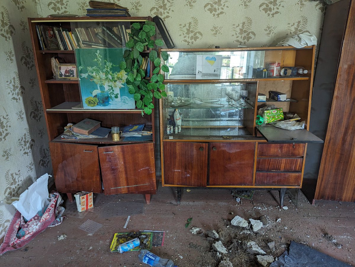 The day before the Russian assault, we walked around the village and I was looking for a place for a machine-gun point in abandoned houses. Life has stopped here, and the picture says that the Russians are occupiers. The house was practically destroyed by them during the fighting