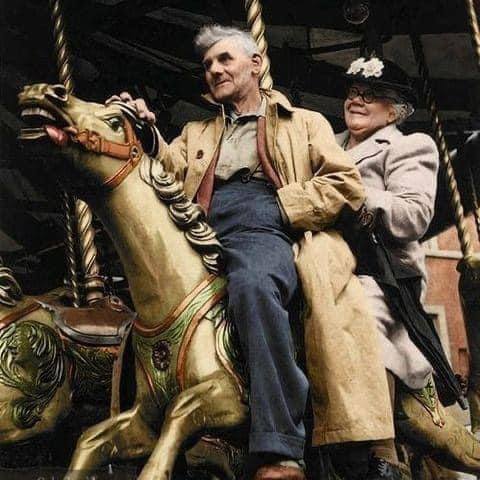 Lovely remastered image of an elderly couple on a carousel in London, 1952. >FH