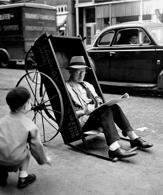 Fred Stein
Man reads on an improvised chair