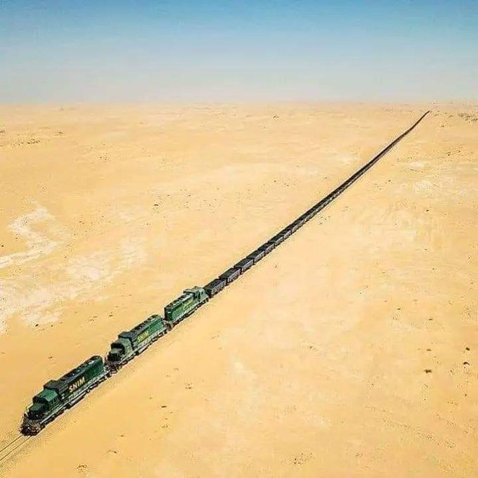 The Mauritanian iron ore train is one of the longest and heaviest trains in the world and the most unique and incredible railway journeys one can take. 

The train is up to 3 km (1.8 miles) in length, travels on a single track of 704 kilometres (437 miles), with 200 – 300 freight