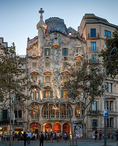 2. Casa Batlló is a vibrant, imaginative building renovated by Gaudí, representing the apex of Modernisme. The facade is rumored to depict the legend of Saint George slaying the dragon, with the roof designed to mimic the dragon's back.