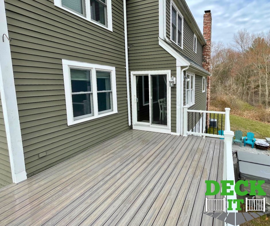 Finished a backyard deck in Natick, MA! 🏡 Trex Enhance Rocky Harbor boards in a picture-framed design with Trex Select rails. Added privacy lattice skirting & white PVC kickboards! 🔨🌟 #deckcompany #deckbuilder #deckdesign