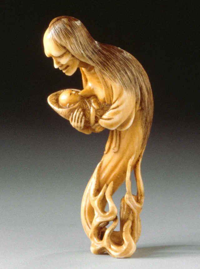 Carving of a ghost nursing her child. Japan, c. 1850.