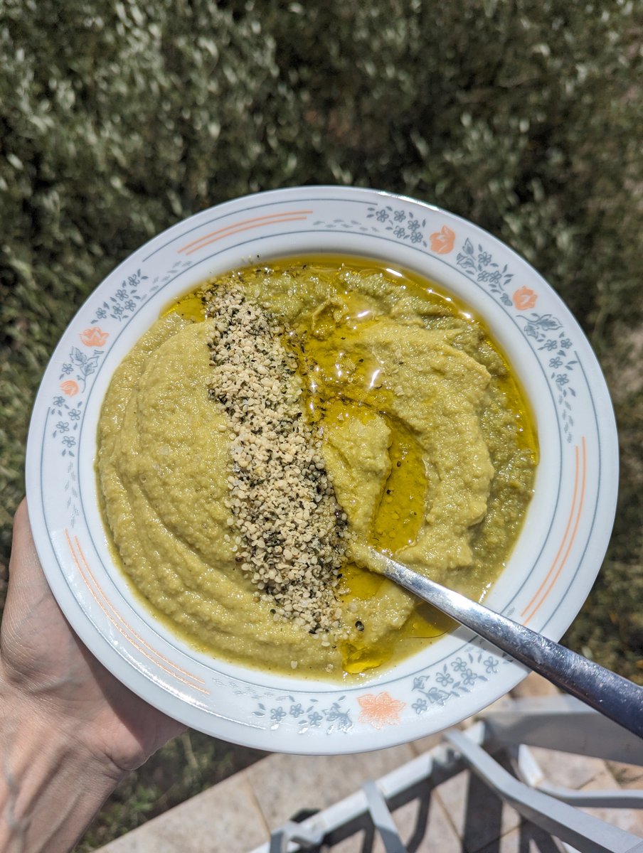 Zucchini hummus with olive oil and hemp seeds