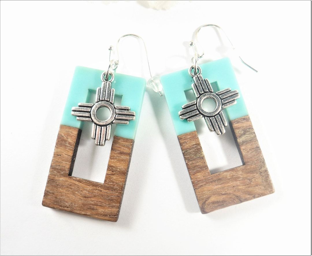 Add a touch of Southwest charm to your style with these unique rectangle Zia dangle earrings creating a perfect blend of tradition and contemporary fashion. buff.ly/4aVhA0r #SantaFe #NewMexico #etsyshop #Albuquerque #etsyjewelry #shopsmall #wiseshopper