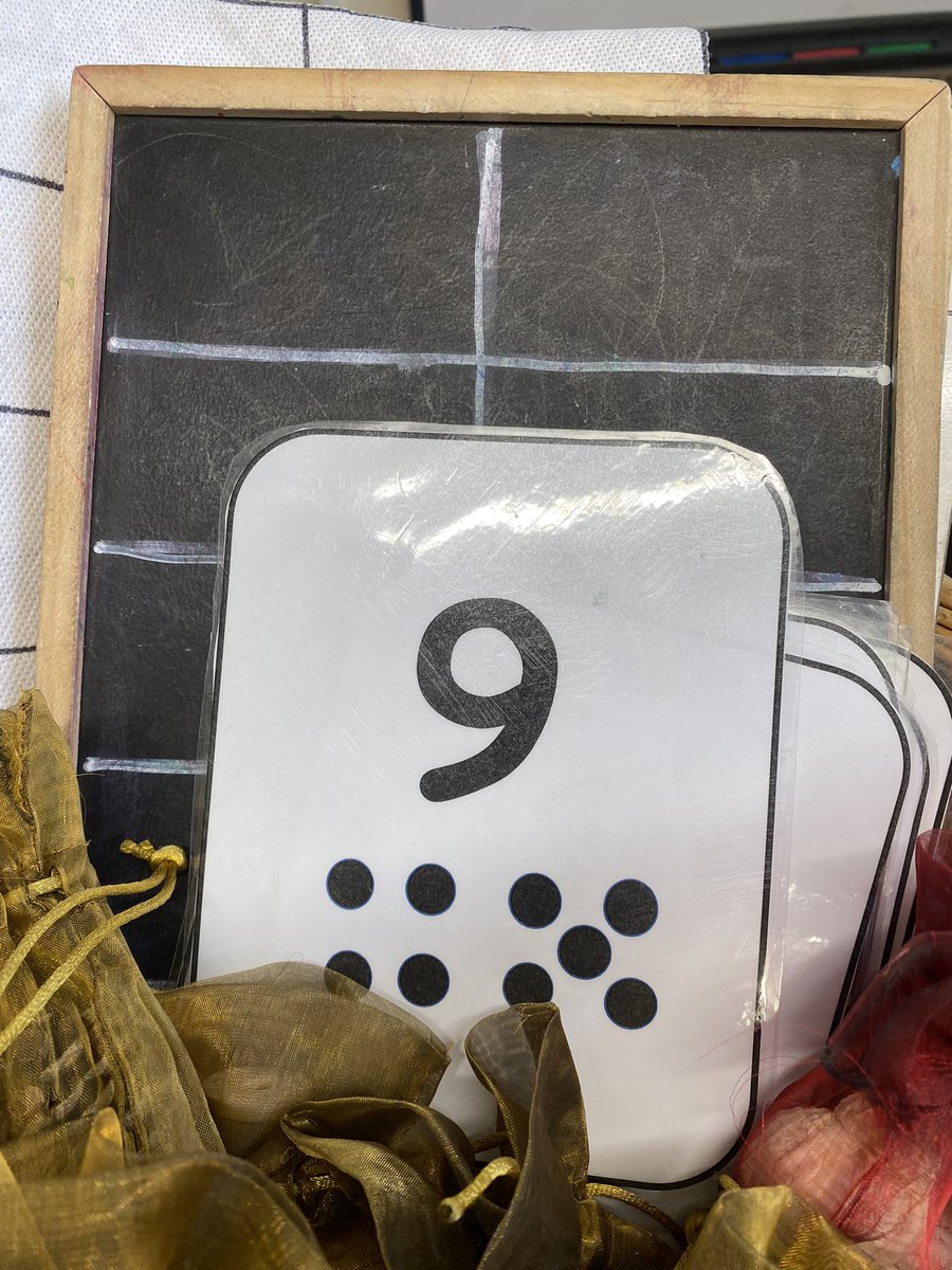 This morning I watched a 2 year old hold this 9 card in her hand and then go along the number line, turning each disc, until she spotted the 9. She then searched in the 10s frame basket for another 9. Pretty cool.