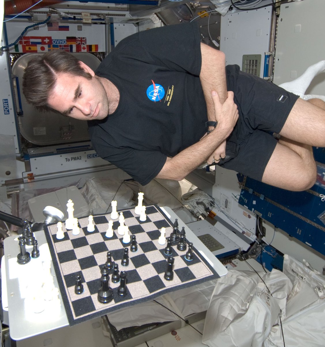 Space Station to Mission Control: It’s your move. ♟️ In this scene from 2008, astronaut Greg Chamitoff heads off against the people of Earth in an Earth vs. space chess game! How did he get the pieces to stay on the board? Velcro, of course! #ArchivesGames #ArchivesHashtagParty