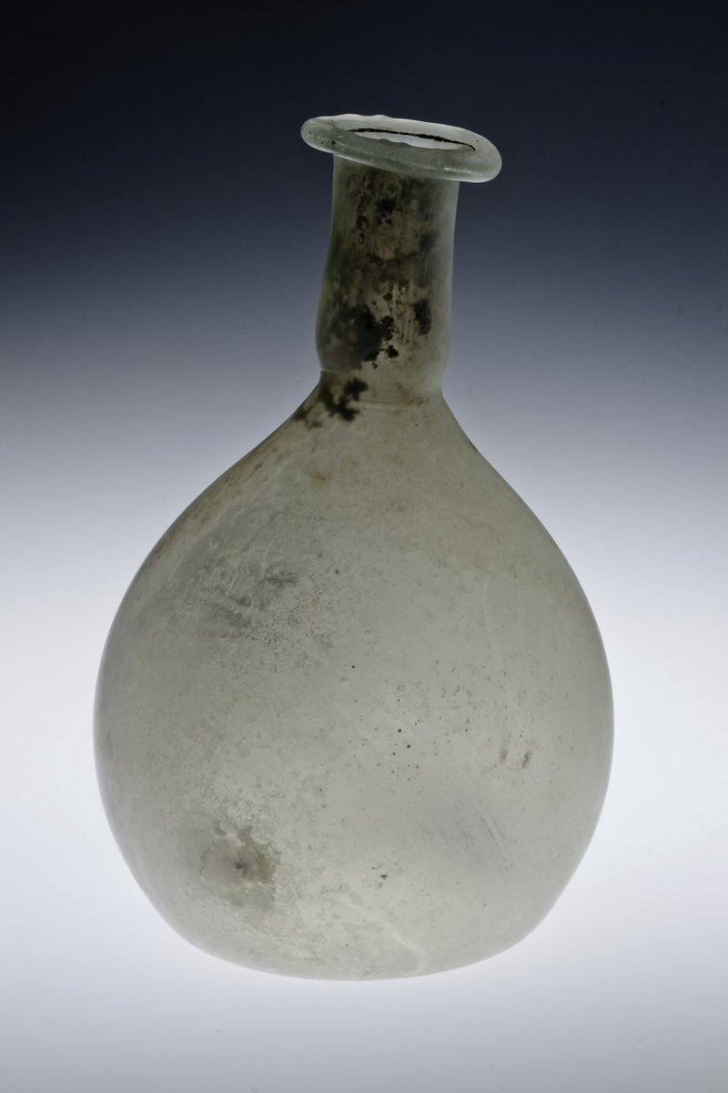 This week's #FindsFriday is an exquisite #Roman glass bottle discovered intact! Dating to the late second or third century, this ovoid or pear-shaped flask is free-blown with colorless glass, its rim folded inwards and flattened down.  #RomanGlass #Archaeology #RomanBritain