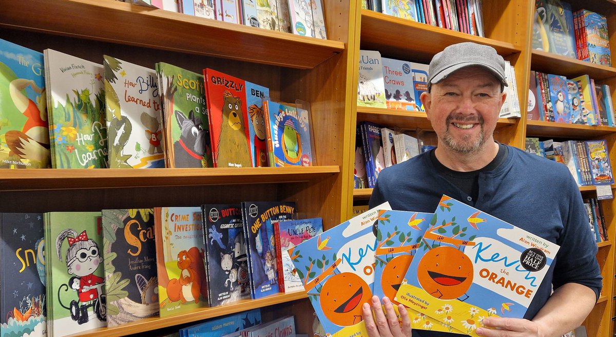 🍊📚 @akwindram popped into @WaterstonesOban to sign some more copies of his latest #picturebook #KevinTheOrange. You might notice the 2 shelves of Little Door Books he is standing beside. Thanks, team #Oban @Waterstones. #authors and #illustrators, can you spot your books 😀