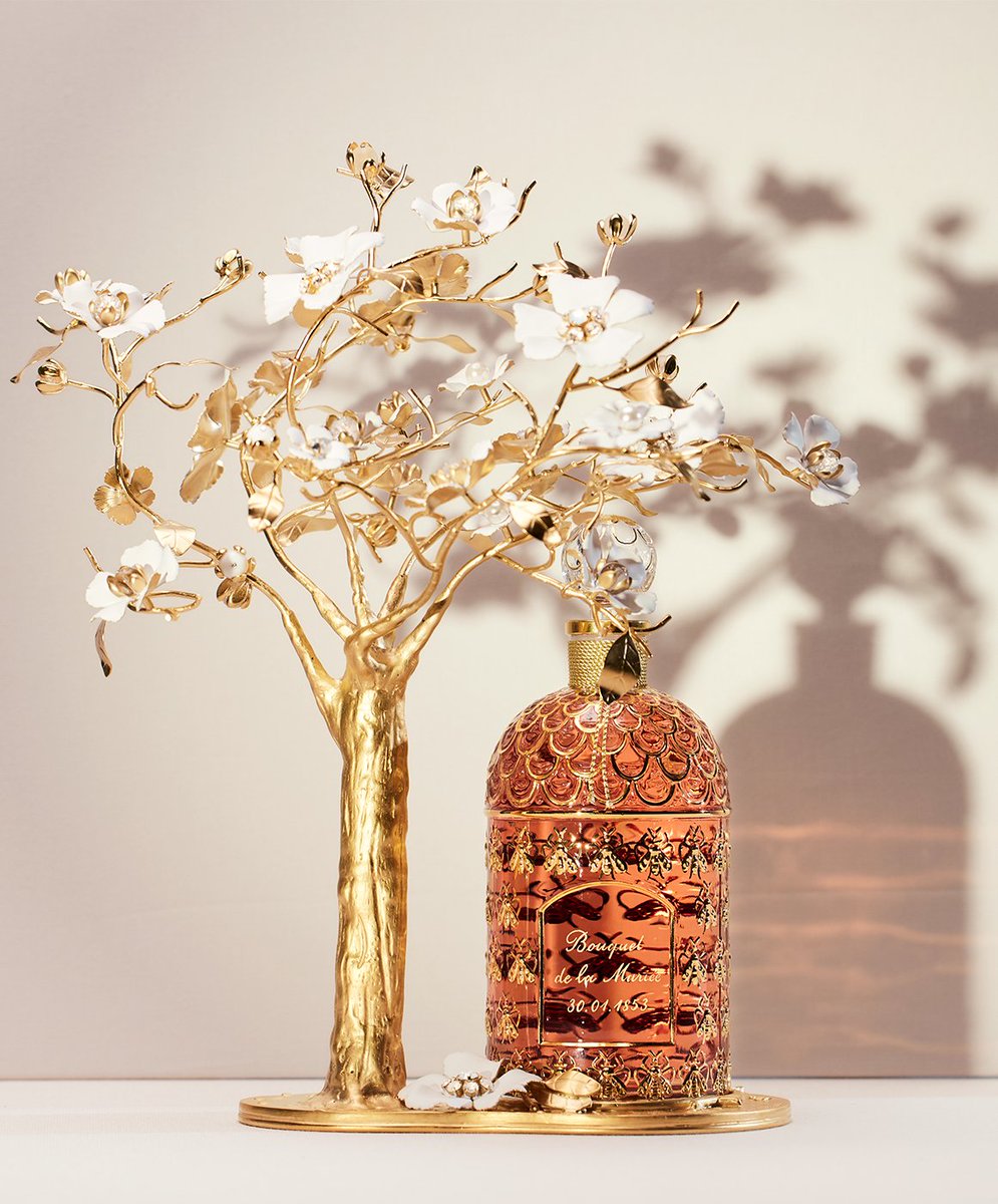 Swipe to see craftsmanship in bloom. Guerlain's Bee Bottle is sheltered by jeweller Philippe Ferrandis' sculpted apple tree in a symbol of union and happiness, complete with exquisite bejewelled brooch, to be worn and treasured forever in a new Exceptional Piece.

#Guerlain