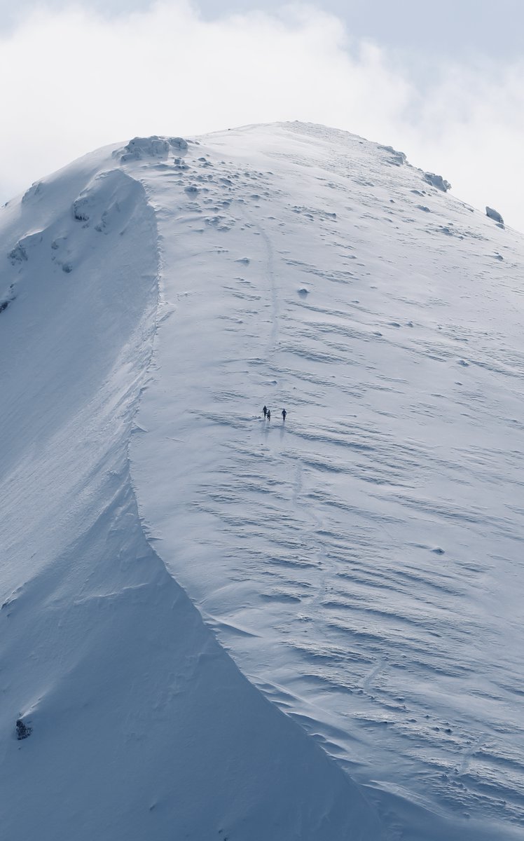 On the 6th March 2022 I had a superb winter walk around Ben More and Stob Binnein. As I ascended Ben More I saw three guys I'd been speaking to earlier, who were coming off Stob Binnein. The figures gave scale to the curving snowline. I took my camera out and snapped them. (1/2)