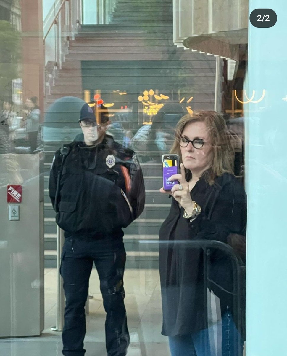 Karen Ortman, NYU's Associate VP of Campus Safety Operations, watches from behind glass as students are arrested, their belongings thrown into garbage bags, while filming on her personal phone, violating FERPA laws. Is this legal & following NYU rules?