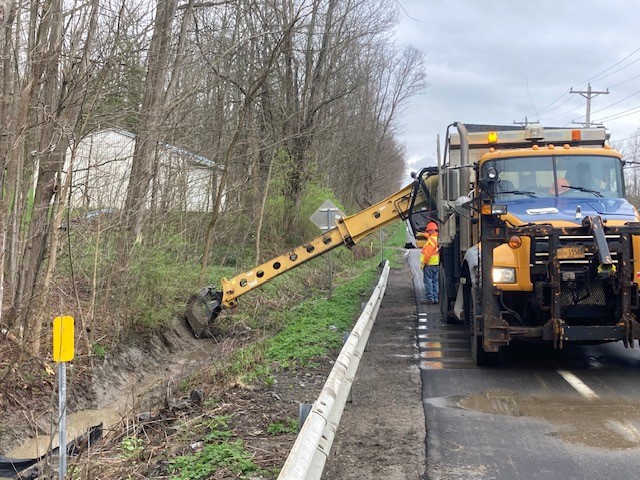 Cleaning and shaping the drainage ditches along Route 430 in Mayville in Chautauqua County to maximize efficiency