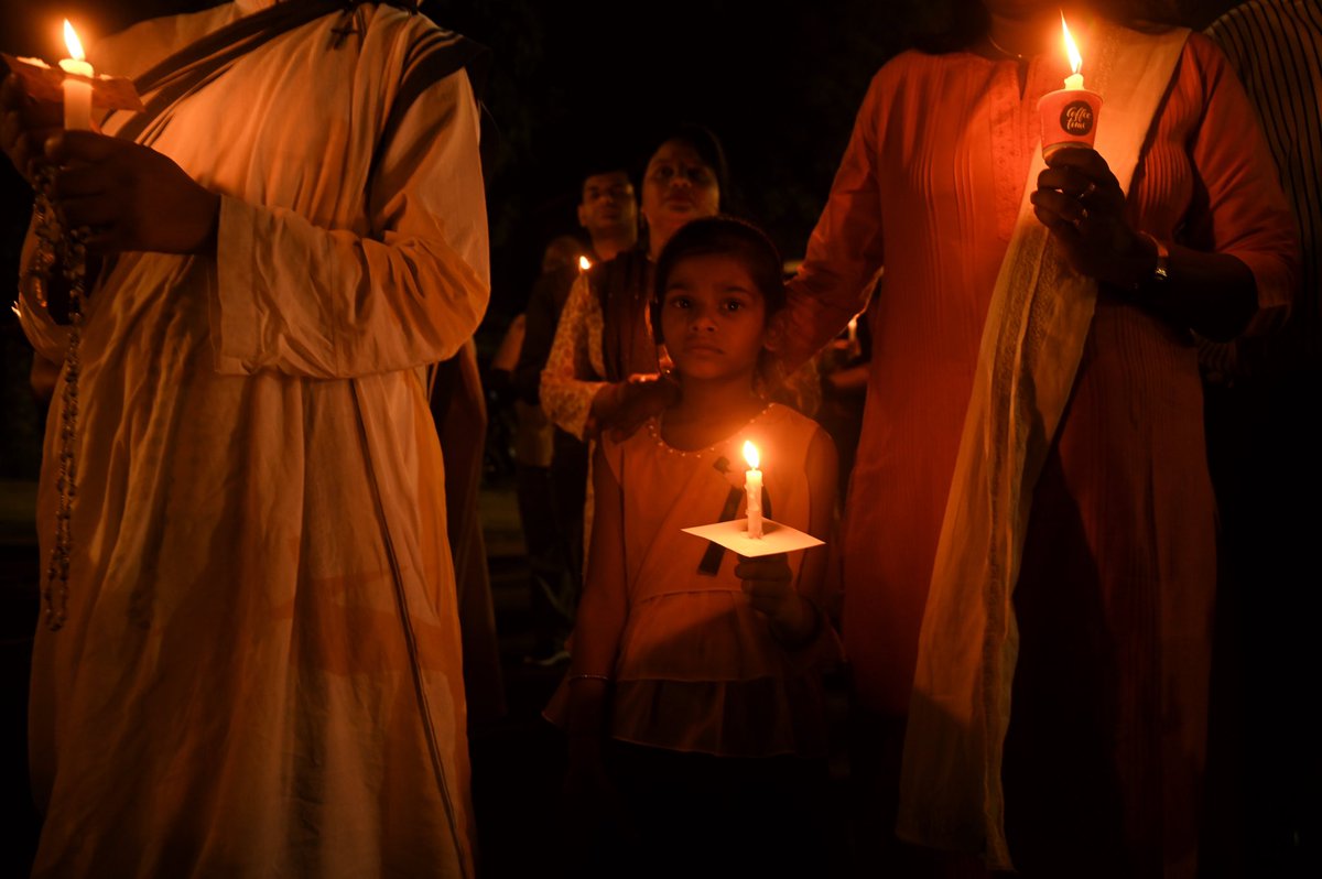 A Small girl  can be seen holding candles during a Candle Light Vigil on the 1 anniversary of the Manipur violence between Kuki-Zo and Meitei groups, In New Delhi, India on 3 May, 2024 . 
#Manipur_Violence #Kuki_Zo #candlelightvigil #1anniversary #Manipurconflict #church #delhi