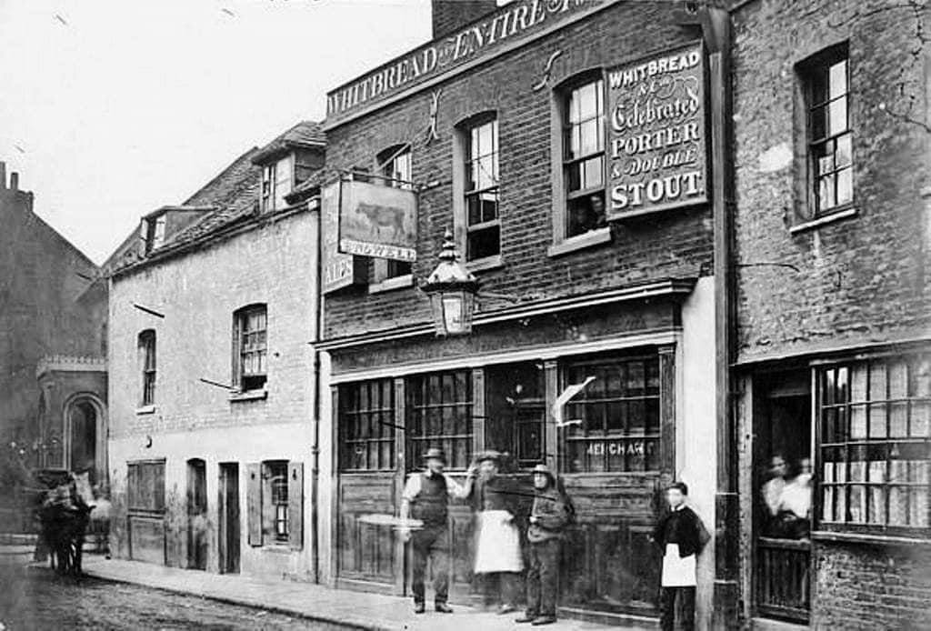 The Old Red Cow public house & adjoining buildings in Prince's Street near corner of Salamanca St. Lambeth c1860. House with the portico to left is the former home of Jared Hunt a soap boiler. Pub dates c1780s but demolished in 1955 when area became offices, now a hotel. >FH
