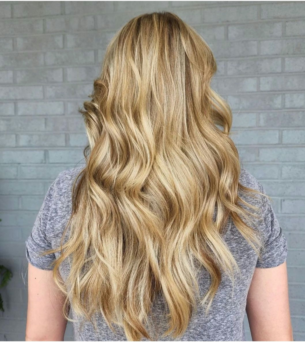 'Radiant as sunshine ☀️: This stunning blonde beauty is rocking all-over babylights, enhancing her natural glow ✨. #BlondeBombshell #Babylights #HairGoals #GoldenGoddess'