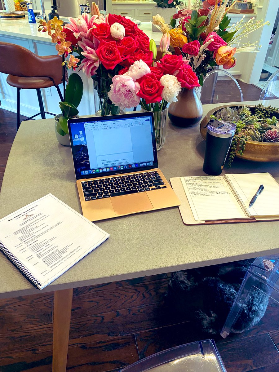 Don’t mind us. Just me, Benny (he’s under the table), my coffee (delish), & my old bday flowers (smelling divine) working on a manuscript today about communication in the trauma bay & the biases that different team members feel. Stay tuned. 🙂